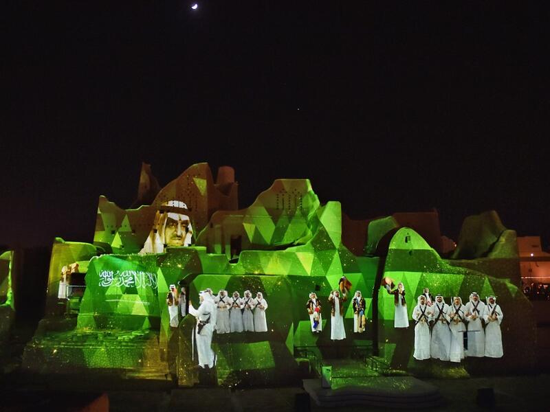 An animation is projected at the historical site of al-Tarif in Diriyah district, on the outskirts of Saudi capital Riyadh, on November 20, 2020. Saudi Arabia hosts the G20 summit on November 21 in a first for an Arab nation, with the downsized virtual forum dominated by efforts to tackle a resurgent coronavirus pandemic and crippling economic crisis. FAYEZ NURELDINE / AFP
