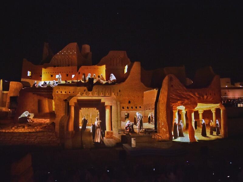 An animation is projected at the historical site of al-Tarif in Diriyah district, on the outskirts of Saudi capital Riyadh, on November 20, 2020. Saudi Arabia hosts the G20 summit on November 21 in a first for an Arab nation, with the downsized virtual forum dominated by efforts to tackle a resurgent coronavirus pandemic and crippling economic crisis. FAYEZ NURELDINE / AFP