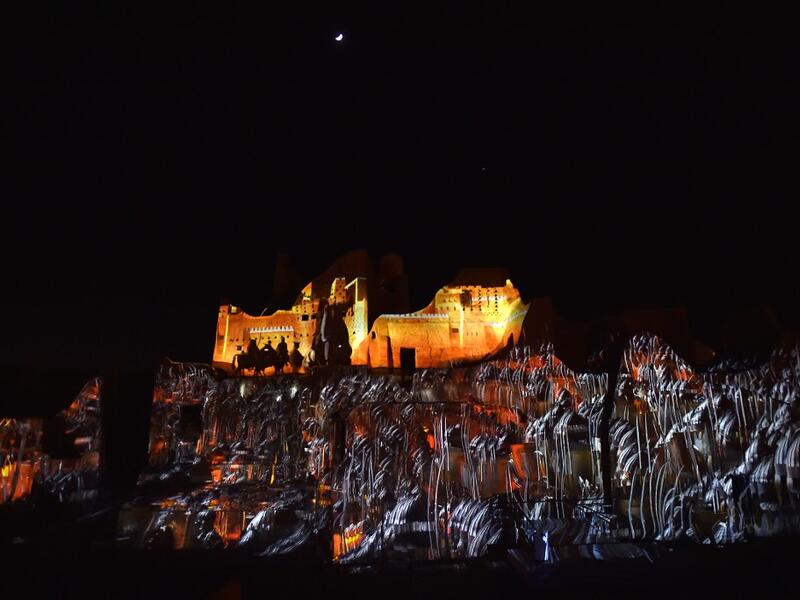 An animation is projected at the historical site of al-Tarif in Diriyah district, on the outskirts of Saudi capital Riyadh, on November 20, 2020. Saudi Arabia hosts the G20 summit on November 21 in a first for an Arab nation, with the downsized virtual forum dominated by efforts to tackle a resurgent coronavirus pandemic and crippling economic crisis. FAYEZ NURELDINE / AFP