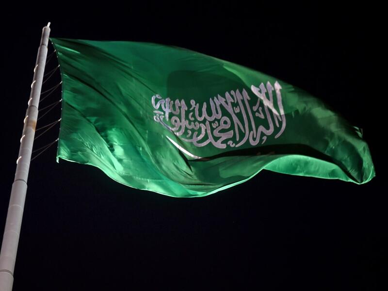 The Saudi national flag flutters at the historical site of al-Tarif in Diriyah district, on the outskirts of Saudi capital Riyadh, on November 20, 2020. Saudi Arabia hosts the G20 summit on November 21 in a first for an Arab nation, with the downsized virtual forum dominated by efforts to tackle a resurgent coronavirus pandemic and crippling economic crisis. FAYEZ NURELDINE / AFP