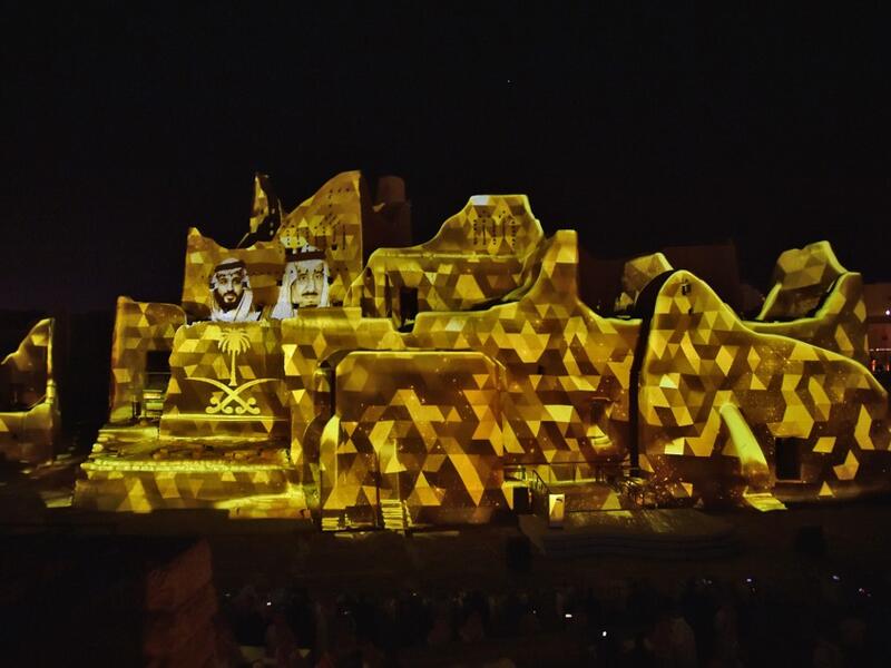 A picture of Saudi King Salman bin Abdulaziz (R) and his son Crown Prince Mohammed bin Salman is projected at the historical site of al-Tarif in Diriyah district, on the outskirts of Saudi capital Riyadh, on November 20, 2020. Saudi Arabia hosts the G20 summit on November 21 in a first for an Arab nation, with the downsized virtual forum dominated by efforts to tackle a resurgent coronavirus pandemic and crippling economic crisis. FAYEZ NURELDINE / AFP