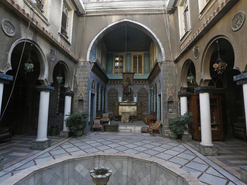 A view shows the courtyard of Naasan palace, a historical landmark, in the old part of Syria's capital Damascus on November 18, 2020. The old city of the Syrian capital is famed for its elegant century-old houses, usually two storeys built around a leafy rectangular courtyard with a carved stone fountain at its centre. While the capital has been largely spared the violence of Syria's almost ten-year war, several of these traditional homes have been abandoned by their owners or damaged in the conflict. AFP