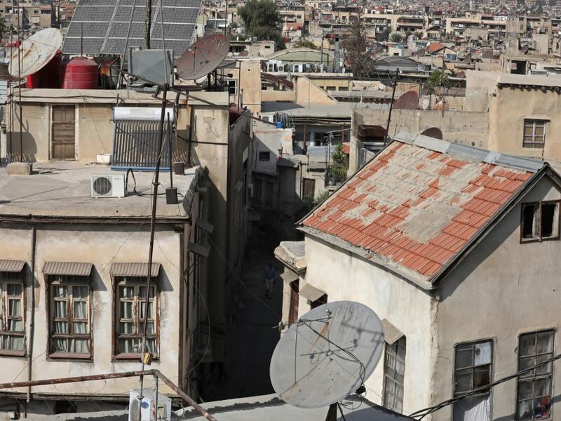 A partial view shows the old part of Syria's capital Damascus on October 28, 2020. The old city of the Syrian capital is famed for its elegant century-old houses, usually two storeys built around a leafy rectangular courtyard with a carved stone fountain at its centre. While the capital has been largely spared the violence of Syria's almost ten-year war, several of these traditional homes have been abandoned by their owners or damaged in the conflict. LOUAI BESHARA / AFP