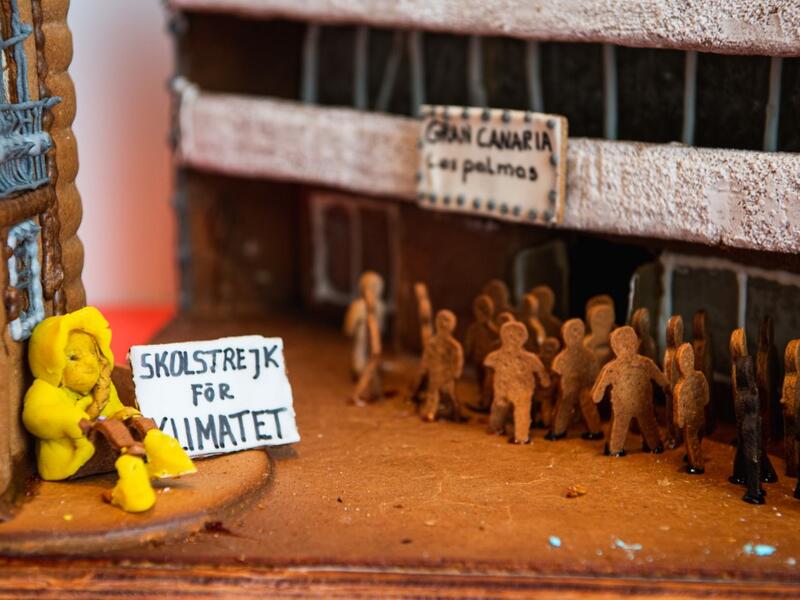 A gingerbread model with the shape of Swedish climate activist Greta Thunberg, is pictured at the ArkDes, Sweden’s national centre for architecture and design, during this year's Gingerbread House 2020 competition with the theme 'Distance', on December 7, 2020 in Stockholm, Sweden. Jonathan NACKSTRAND / AFP