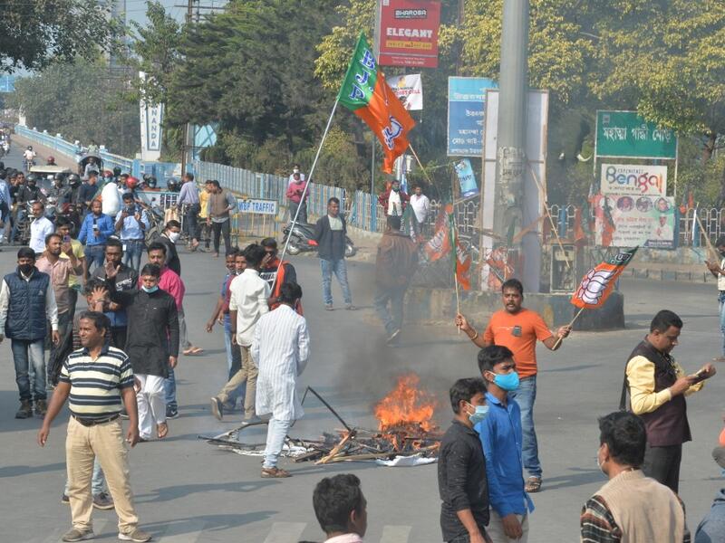 Bharatiya Janata Party supporters block a road during a 12-hour general strike in North Bengal called by BJP to protest against the West Bengal state government in Siliguri on December 8, 2020. Diptendu DUTTA / AFP