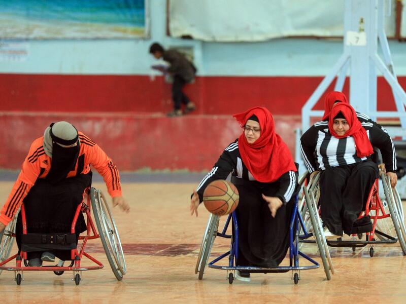 Disabled Yemeni women take part in a local wheelchair basketball championship in Yemen's capital Sanaa on December 8, 2020. In conflict-ridden Yemen, nine teams, including five-all women groups, competed in a local championship for the disabled in the capital Sanaa, which has been under rebel control since 2014. The players are competing to be embraced by society for their strengths rather than be viewed as a burden during the time of war. Mohammed HUWAIS / AFP