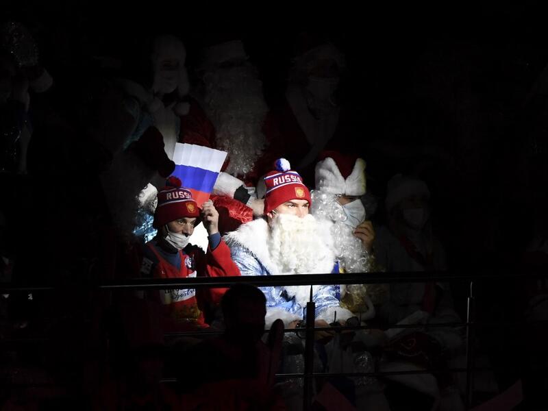 Russia's team fans dressed as Ded Moroz (Santa Claus or Father Frost) watch the Channel One Cup of the Euro Hockey Tour ice hockey match between Russia and Czech Republic at CSKA Arena in Moscow on December 19, 2020. Russia won the game 4-1.  Natalia KOLESNIKOVA / AFP