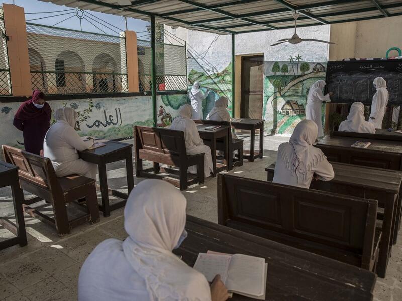 This picture taken during a government-guided tour on December 27, 2020 shows inmates attending a literacy class at al-Qanatir women's prison, at the tip of the Nile delta in Qalyoubiya province, about 30 kilometres north of Egypt's capital. Khaled DESOUKI / AFP