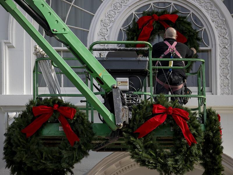 Christmas wreaths are installed at the White House on November 25, 2020 in Washington, DC. The White House is still planning Holiday parties despite federal and state warning about Covid-19 in the middle of a pandemic. Tasos Katopodis/Getty Images/AFP