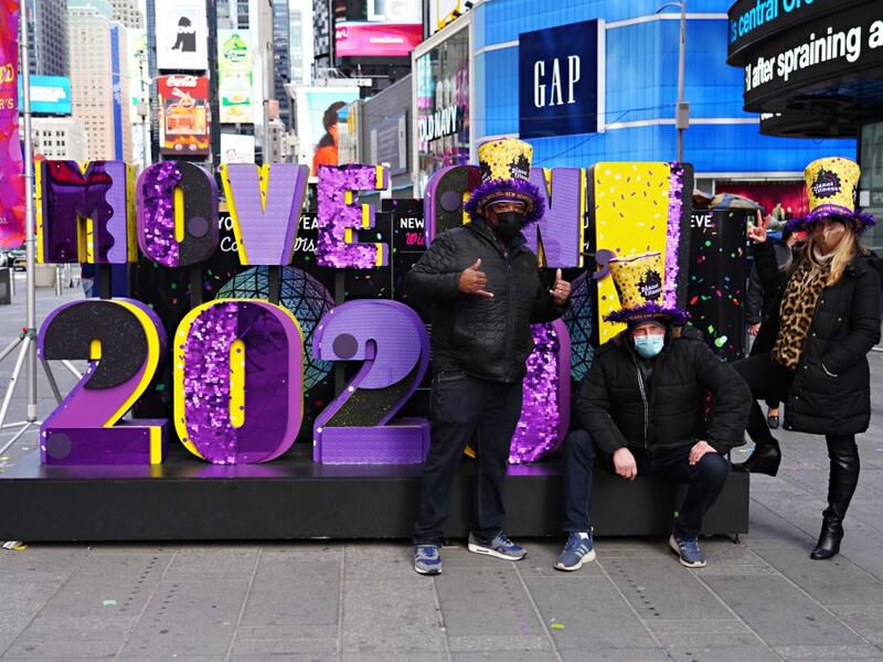Guests attend as Times Square New Year's Eve co-organizers Times Square Alliance and Countdown Entertainment, along with presenting sponsor Planet Fitness, release multicolored confetti at Hard Rock Cafe Marquee on December 29, 2020 in New York City. Cindy Ord/Getty Images/AFP Cindy Ord / GETTY IMAGES NORTH AMERICA / Getty Images via AFP