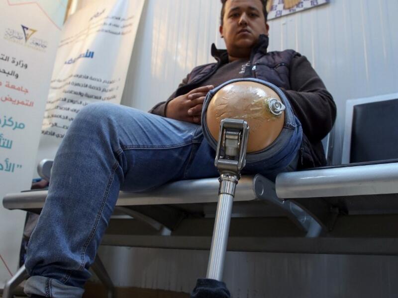 A patient waits for a consultation at the National Center for Artificial Limbs, in Libya's port city of Misrata, on December 17, 2020. With Libya's health sector left in tatters by its multiple conflicts since the 2011 revolution, war-wounded Libyans are often sent abroad for treatment, at the expense of the state. However, A national centre for prostheses, being established in Misrata, already has a patient waiting list of more than 3,000 amputees
