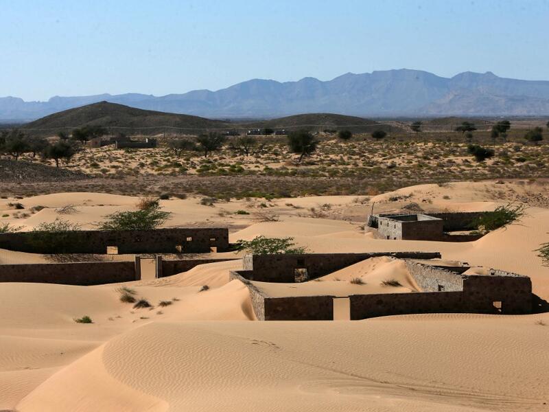 The advance of the desert is not specific to the sultanate of Oman, and experts say climate change is one of the factors propelling the phenomenon in different parts of the world.  MOHAMMED MAHJOUB / AFP
