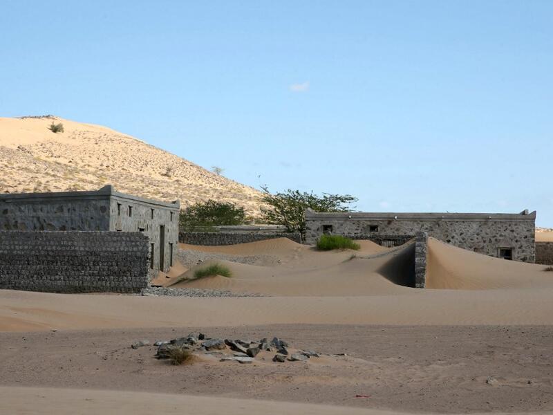 This picture taken on December 31, 2020, shows abandoned houses in the Omani village of Wadi al-Murr, about 400 kms (250 miles) southwest of the capital Muscat. MOHAMMED MAHJOUB / AFP