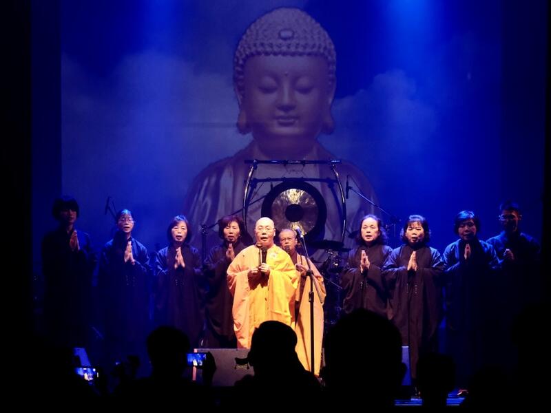 This picture taken on January 2, 2021 shows Buddhist nun Miao-ben (C), a vocalist of Taiwanese death metal band 'Dharma' performing during a concert in Taichung. Sam Yeh / AFP