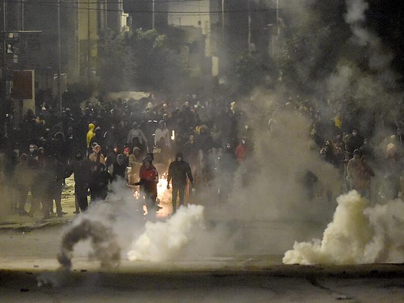 The social unrest comes at a time of economic crisis, worsened by the pandemic, that has sparked rapid inflation and high youth unemployment and led many people to leave the North African country. FETHI BELAID / AFP