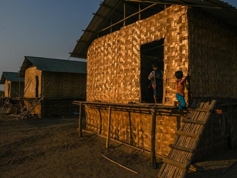This photo taken on January 11, 2021 shows Chin children playing in Bethel village in Hmawbi, on the outskirts of Yangon, where hundreds of members of the Chin ethnic community have settled after being displaced by fighting between Myanmar's military and the Arakan Army in the country's north.  Ye Aung THU / AFP