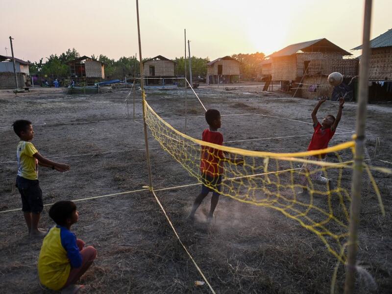 This photo taken on January 11, 2021 shows Chin children playing in Bethel village in Hmawbi, on the outskirts of Yangon, where hundreds of members of the Chin ethnic community have settled after being displaced by fighting between Myanmar's military and the Arakan Army in the country's north.  Ye Aung THU / AFP