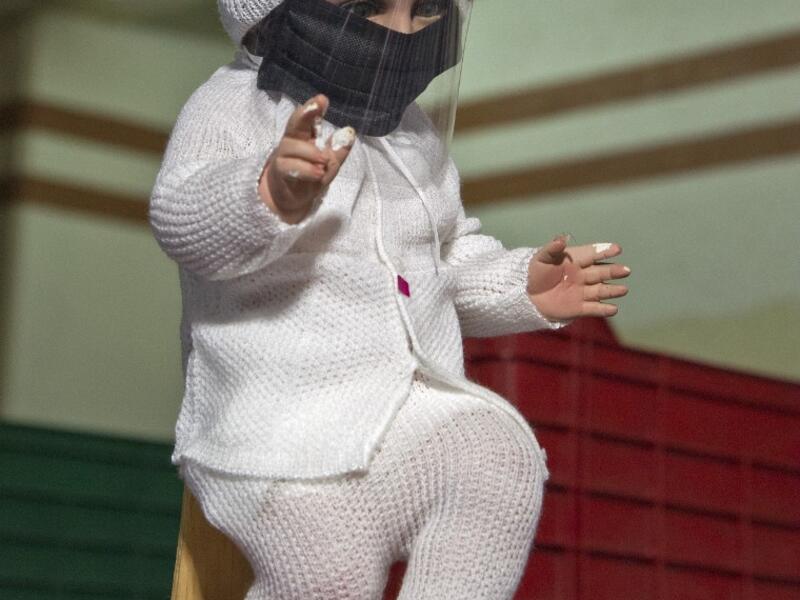 View of a doll displayed for sale at the ¨Nino Uribe¨ traditional Mexican store in Mexico City on January 27, 2021. ¨Nino Uribe¨ sells representations of the Baby Jesus called Baby COVID to raise awareness on the preventive measures to take amid the COVID-19 coronavirus pandemic. CLAUDIO CRUZ / AFP