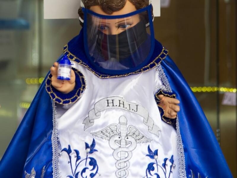 View of a doll displayed for sale at the ¨Nino Uribe¨ traditional Mexican store in Mexico City on January 27, 2021. ¨Nino Uribe¨ sells representations of the Baby Jesus called Baby COVID to raise awareness on the preventive measures to take amid the COVID-19 coronavirus pandemic. CLAUDIO CRUZ / AFP