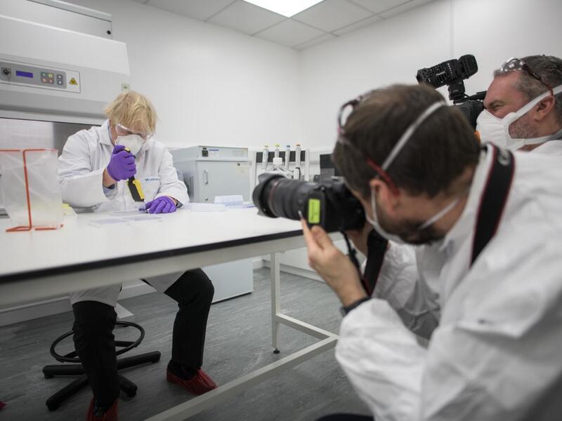 ***Pool photo***UK Prime Minister Boris Johnson today (January 28th) visited the French biotechnology laboratory Valneva in Livingston where they will be producing a Covid 19 vaccine on a large scale The Prime Minister tried his hand at one of the tests with Kerri Symington , quality control technician Pic by Wattie Cheung .......28/1/21tel 07774 885266email.... wattiecheung@mac.com Johnson visited Scotland on January 28 where he rejected calls for a second referendum on independence in Scotland, stating th