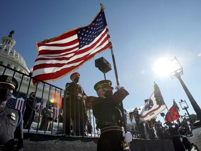 The military honor guard arrives during the 59th Presidential Inauguration on January 20, 2021 in Washington, DC. During today’s inauguration ceremony Joe Biden becomes the 46th president of the United States. Greg Nash - Pool/Getty Images/AFP
