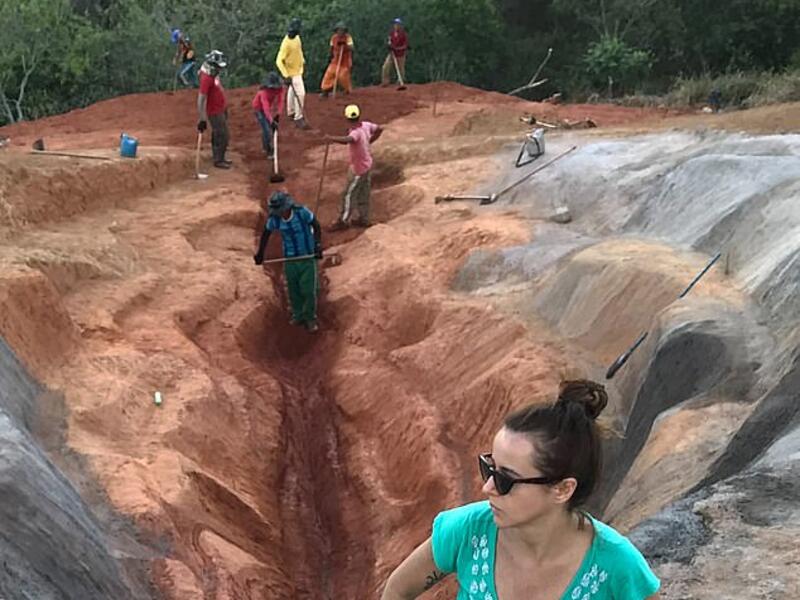 The scarlet sculpture, titled 'Diva', stretches for 33 metres and was built into the hillside with the help of diggers. Visual artist Juliana Notari is pictured above. (Instagram)