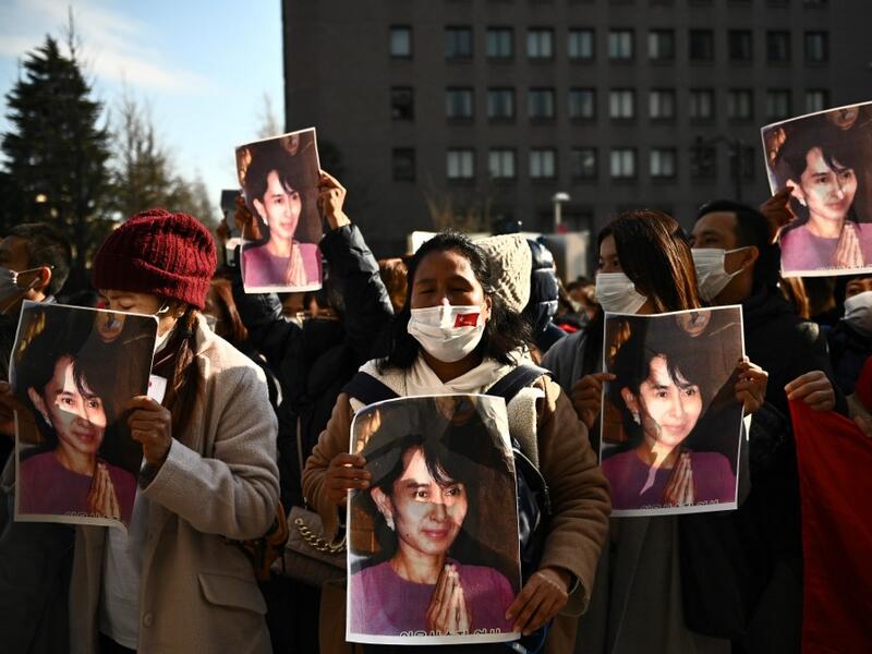 A group of Myanmar activists hold the portrait of Aung San Suu Kyi during a protest outside the United Nation university in Tokyo on February 1, 2021 following a military coup in the country by a general after arresting civilian leader Aung San Suu Kyi and other senior officials. Philip FONG / AFP