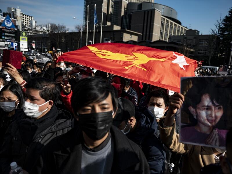 Myanmar activists chant slogans during a protest outside the United Nations University building in Tokyo on February 1, 2021, after Myanmar's military seized power in a bloodless coup and detaining democratically elected leader Aung San Suu Kyi as it imposed a one-year state of emergency. Philip FONG / AFP