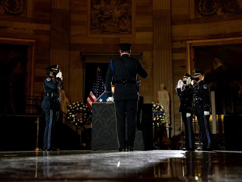 Capitol Police Officers pay their respects to late US Capitol Police officer Brian Sicknick as he lies in honor in the US Capitol Rotunda in Washington, DC February 2, 2021. Erin Schaff / POOL / AFP