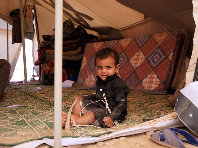 A Yemeni child sits in a tent at a camp for internally displaced people on the outskirts of the northern city of Marib, on February 18, 2021 in the Saudi-backed Yemeni government's last northern bastion. Until early last year, life in Marib city was relatively peaceful despite the Yemen's civil war that erupted in 2014. The United Nations warned last week of a potential humanitarian disaster if the fight for Marib continues, saying it has put "millions of civilians at risk". More than 3.3 million have been 