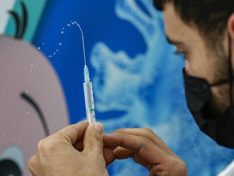 A health worker prepares a dose of the Pfizer-BioNtech COVID-19 coronavirus vaccine at Clalit Health Services, in Israel’s Mediterranean coastal city of Tel Aviv on Jan. 23, 2021. (File/AFP)