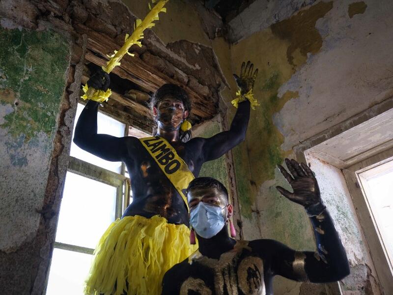 Carnival participants dressed in costume and wearing body paint 