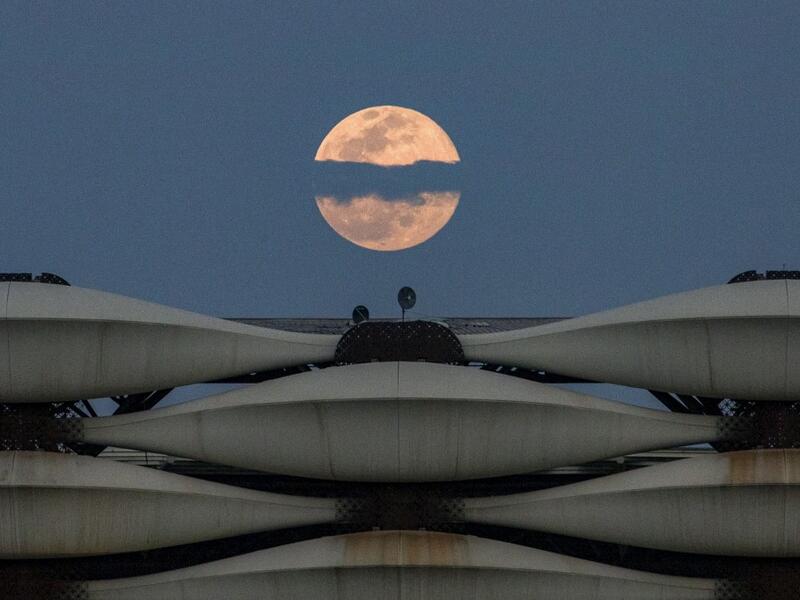  a view of the rising full "Worm Moon" above Basra International Stadium in the southern Iraqi city