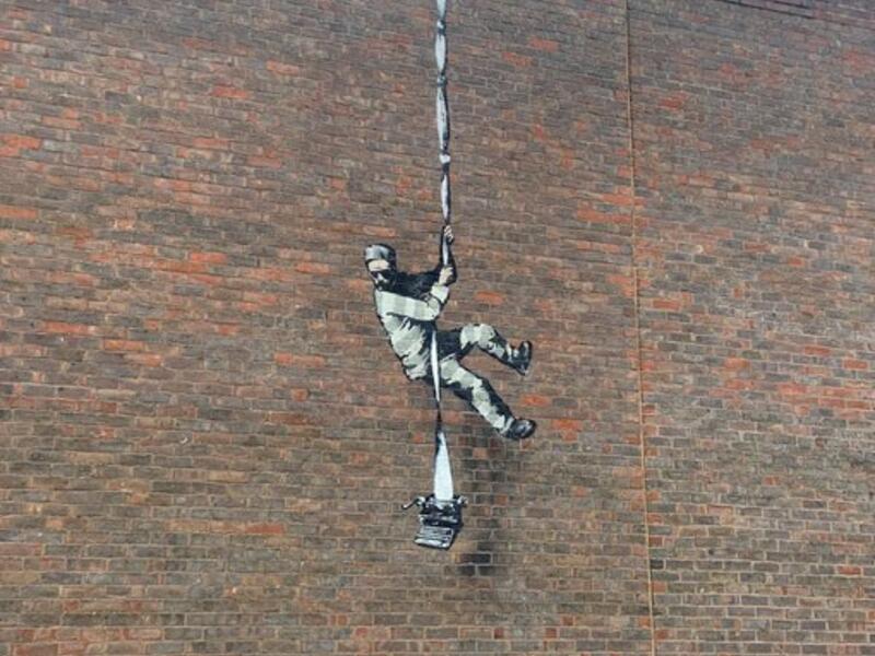 Banksy on a prison wall (Twitter)