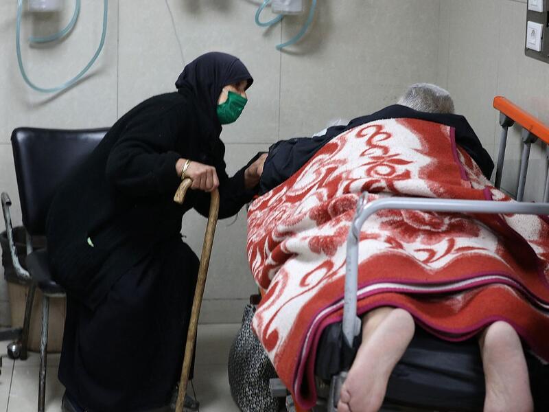 Syrians suspected of being infected with Covid-19 receive treatment at Mouwasat Hospital in Damascus