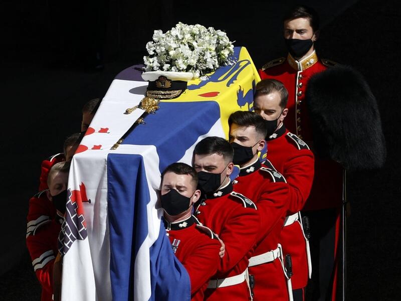 The coffin of Britain's Prince Philip, Duke of Edinburgh is laid onto a modified Land Rover Defender 