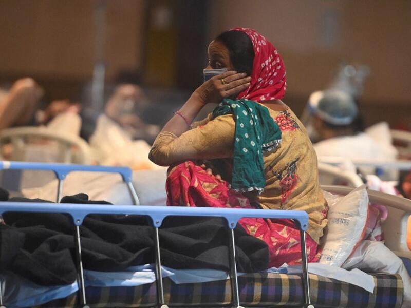 A patient rests inside a banquet hall temporarily converted into a Covid-19 coronavirus ward in New Delhi 
