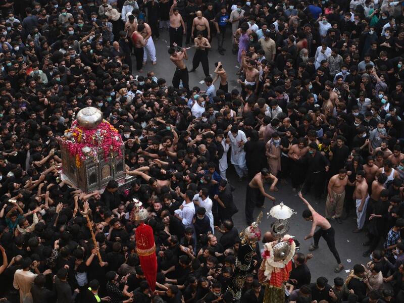 Shiite Muslim devotees take part in a procession 