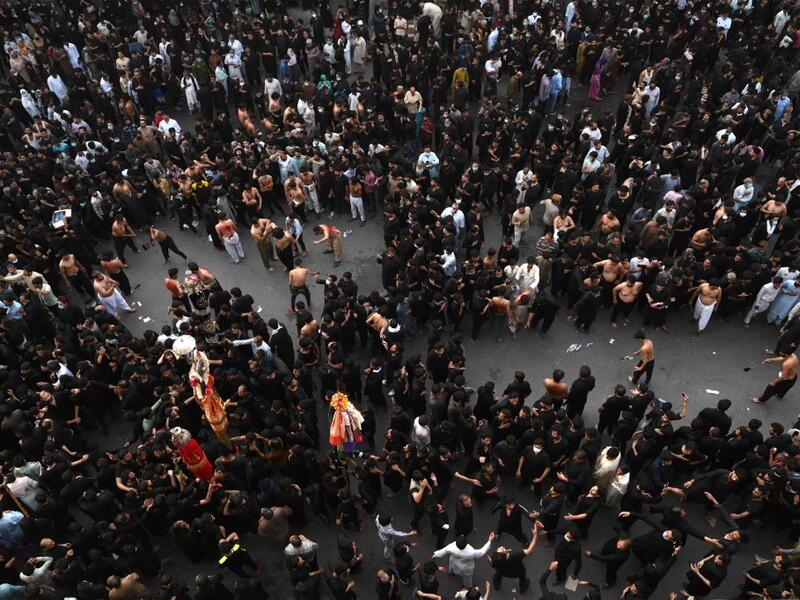 Shiite Muslim devotees take part in a procession 