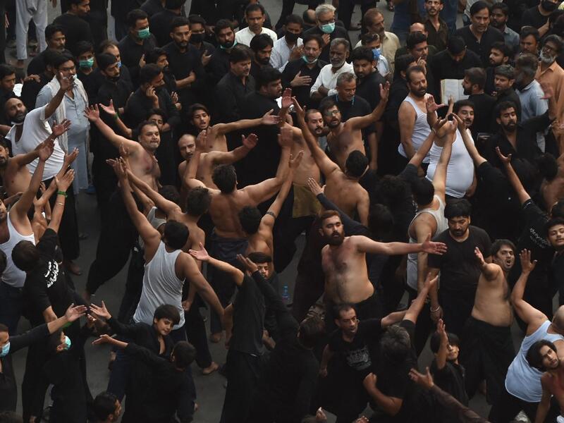 Shiite Muslim devotees take part in a procession to commemorate the death anniversary of Prophet Mohammad's companion and son-in-law Imam Ali in Lahore 