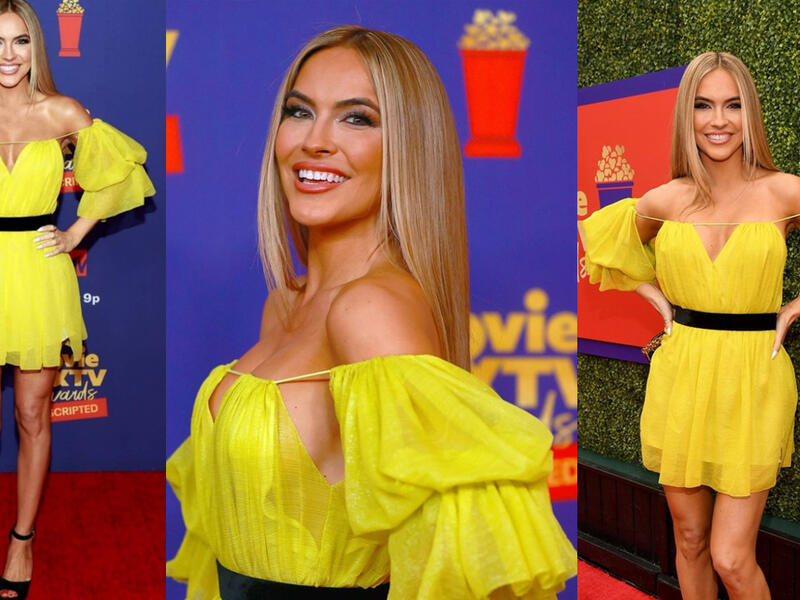 Chrishell Stause arrived on the carpet in bright yellow dress, showing off her tanned figure and cleavage. 