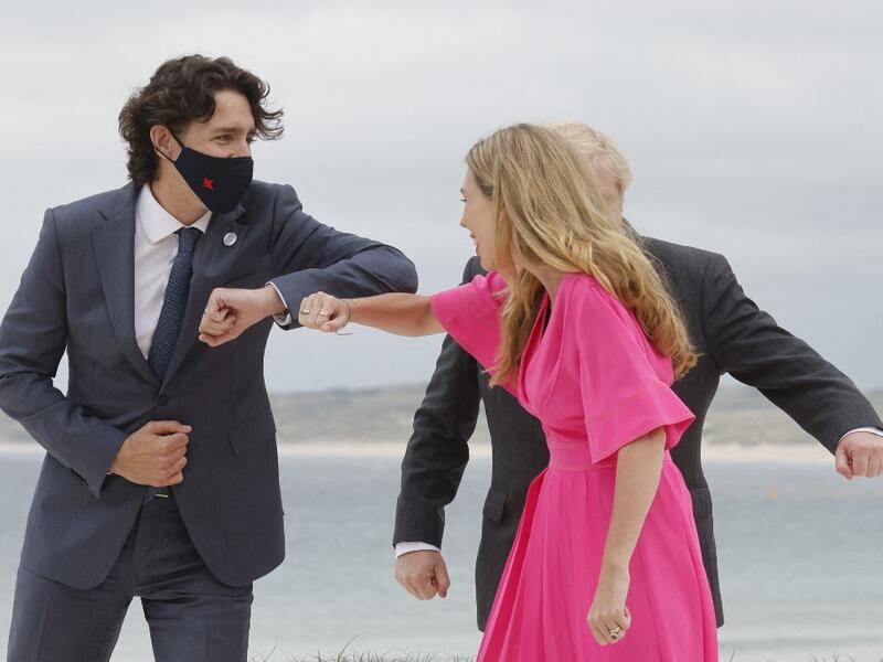 Britain's Prime Minister Boris Johnson (R) and his wife Carrie Johnson welcome Canada's Prime Minister Justin Trudeau prior to the start of the G7 summit in Carbis Bay, Cornwall on June 11, 2021. G7 leaders from Canada, France, Germany, Italy, Japan, the UK and the United States meet this weekend for the first time in nearly two years, for three-day talks in Carbis Bay, Cornwall.