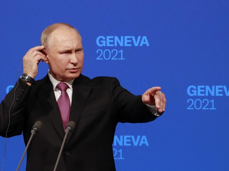 Russia's President Vladimir Putin holds a press conference after meeting with US President in Geneva 