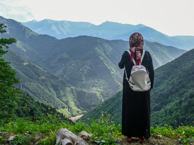 A villager stands at a high point to survey the damage to the hill sides by quarrying in Ikizdere in the Rize Province in the Black Sea region of Turkey on June 7, 2021. A government-friendly company plans to extract 20 million tons of stone from a quarry in the northeastern town of Ikizdere for one of President Recep Tayyip Erdogan's latest development projects. The locals are rising up in protest, challenging the government and its priorities in a region dear to the domineering Turkish leader's heart.