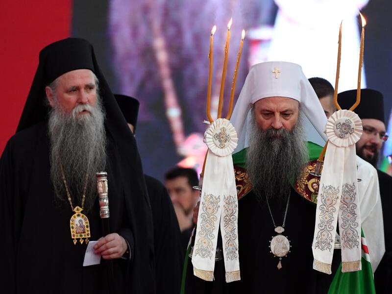 Serbian Orthodox Church's patriarch Porfirije (R) and bishop Joanikije (L) walk through the crowd gathered in front of the orthodox cathedral in Podgorica, on September 4, 2021, to celebrate and show support for the enthronement of the new bishop of the Serbian Orthodox Church in Montenegro. autocephaly.