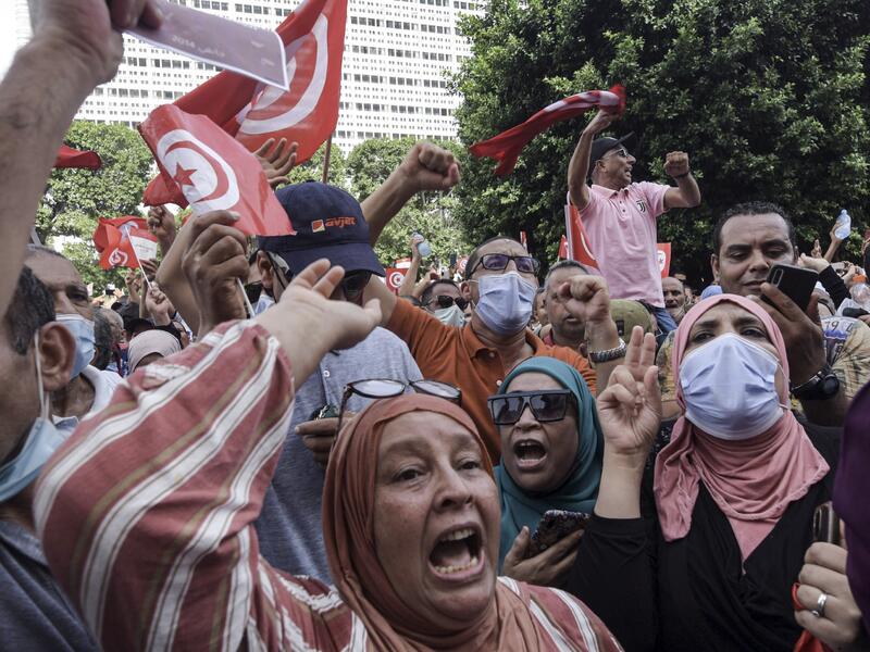 Demonstrators chant slogans during a protest in Tunisia's capital Tunis on September 26, 2021, against President Kais Saied's recent steps to tighten his grip on power. 