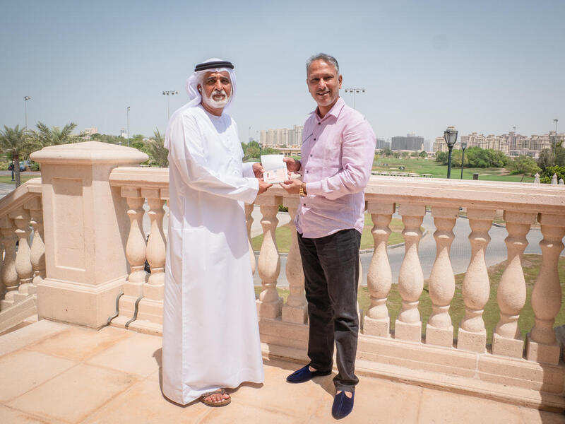 Ismail Sharif, Managing Director of Jumeirah Golf Estates presents Jeev Milkha Singh with his Golden Visa (Photo: Supplied)