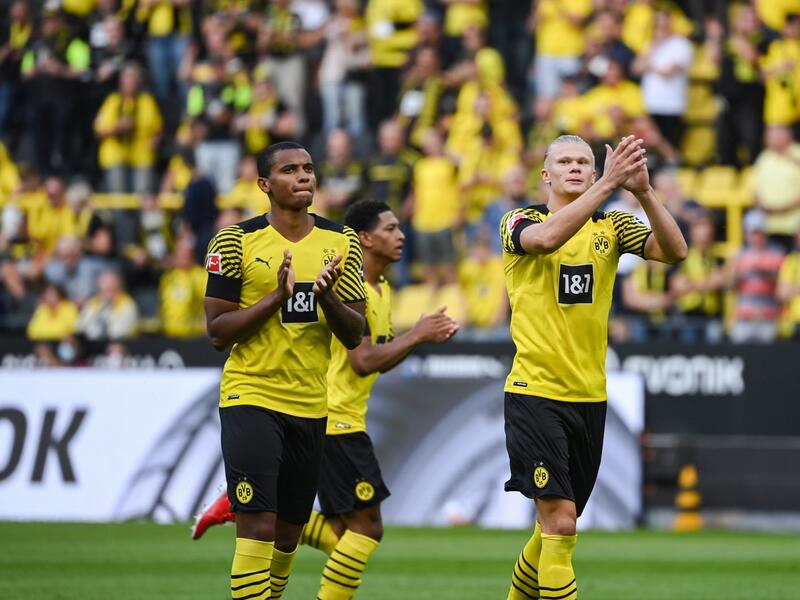 Dortmund's Swiss defender Manuel Akanji and Dortmund's Norwegian forward Erling Braut Haaland react prior to the German first division Bundesliga football match between Borussia Dortmund and Eintracht Frankfurt in Dortmund, western Germany, on August 14, 2021. (Photo by Ina Fassbender / AFP)