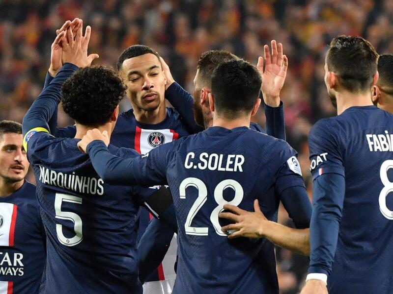 Paris Saint-Germain's French forward Hugo Ekitike (3rd L) celebrates with teammates after scoring his team's first goal during the French L1 football match between RC Lens and Paris Saint Germain (PSG) at the Bollaert-Delelis Stadium in Lens, northern France on January 1, 2023. (Photo by FRANCOIS LO PRESTI / AFP)