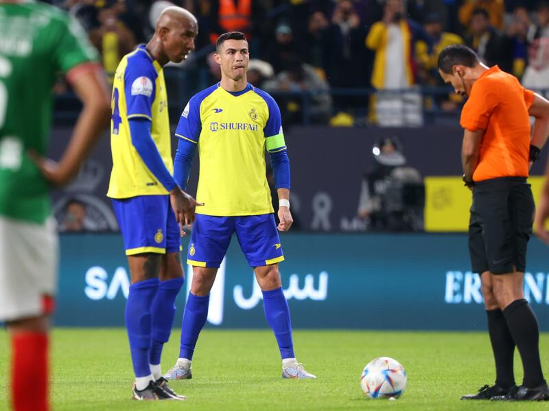 Nassr's Portuguese forward Cristiano Ronaldo (C) attempts a free-kick during the Saudi Pro League football match between Al-Nassr and Al-Ettifaq at the King Fahd Stadium in the Saudi capital Riyadh on January 22, 2023. (Photo by Fayez NURELDINE / AFP)